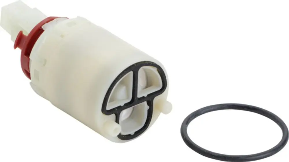 Weißes Kunststoffteil mit rotem Ring und seitlichem Stecker, umgeben von einer schwarzen Dichtung. Ideal Standard Produkt zur Integration in eine Sanitärinstallation.